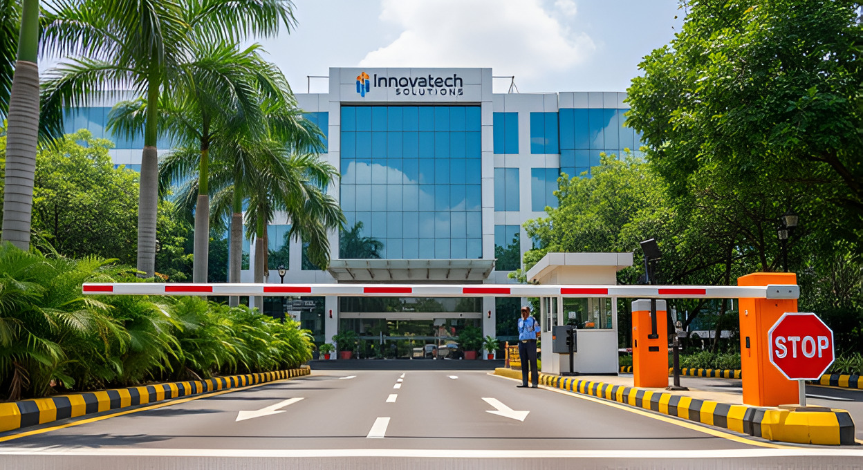 An orange and white automatic boom barrier controlling access to a modern corporate building, emphasizing enhanced security and traffic management at a business entrance